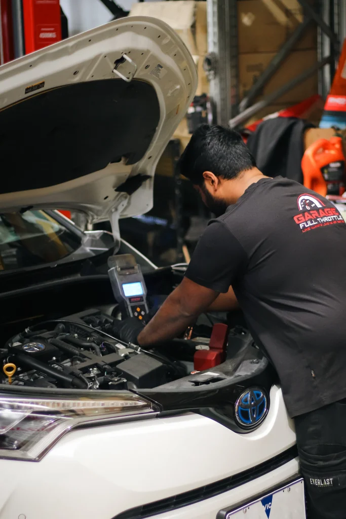 Mechanic Working on Battery & Electronics