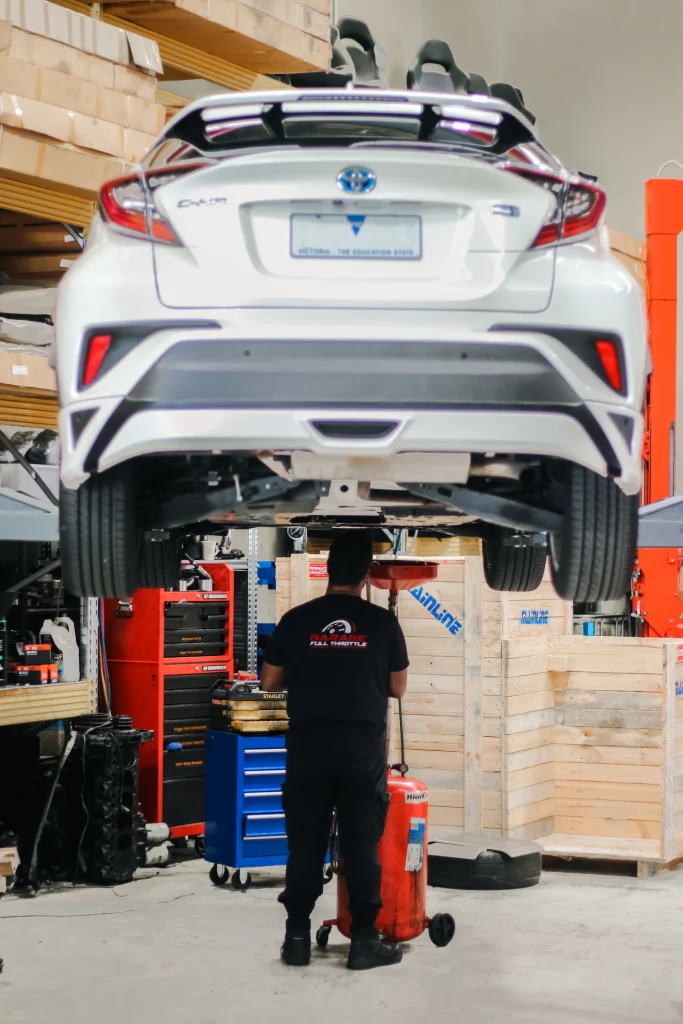 Garage Full Throttle Mechanic Completing a Roadworthy Certificates