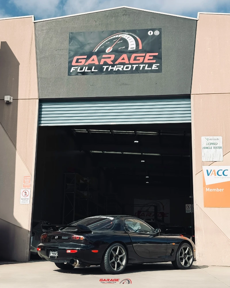 Garage Full Throttle licensed vehicle tester workshop in Craigieburn showing Mazda RX-7 at authorised roadworthy inspection station