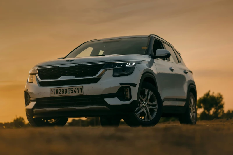 White Kia Seltos SUV at sunset - Expert Kia Mechanic service and maintenance at Garage Full Throttle Craigieburn Melbourne